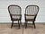 Hand crafted from the mid-1800s, a pair of antique oak Windsor style arm chairs. Terrific antique condition with age worn...