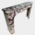 A very large chimneypiece executed in superior quality italian breche violette marble, with large areas of deep purple...