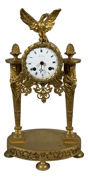 Empire Portico Clock with Egyptian Motifs in Gilt Bronze, 1800