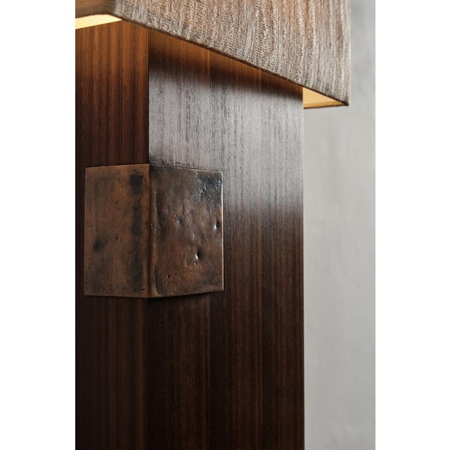 Esperia is a table lamp with base in Eucalyptus wood, that through a thermal process achieves a velvety texture. The...