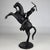 A striking 19th-century bronze equestrian sculpture depicting an African horseman mounted upon a dramatically rearing...