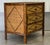 Stylish three drawer night stand crafted in wood with a faux bamboo frame having a faux tortoise finish and grasscloth...