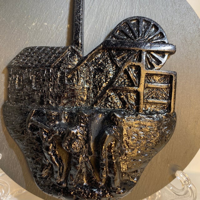 This piece is a Kingmaker Welsh Coal Sculpture. The sculpture is affixed to a piece of slate that is 500 million year...