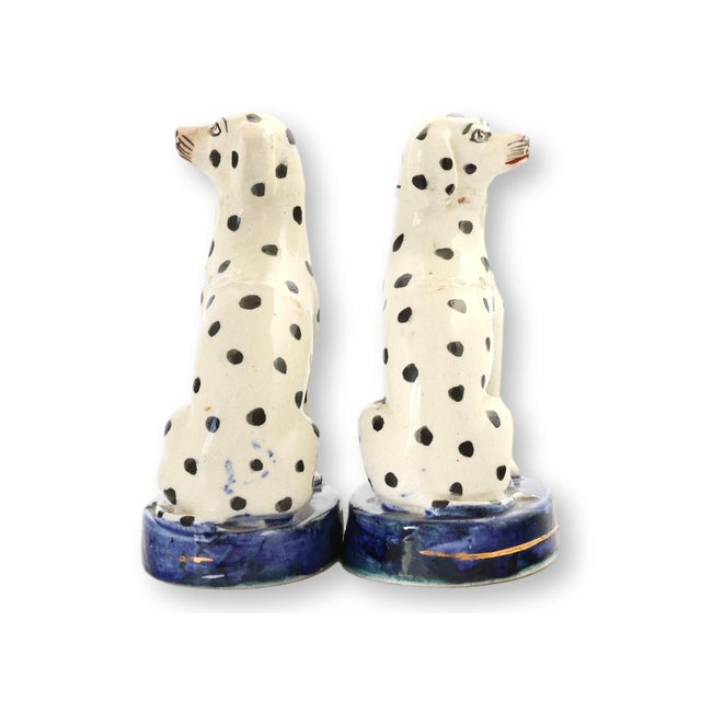 At just 5 inches high, this c.19th century pair of English Staffordshire Dalmatians feels intimate and versatile — the...