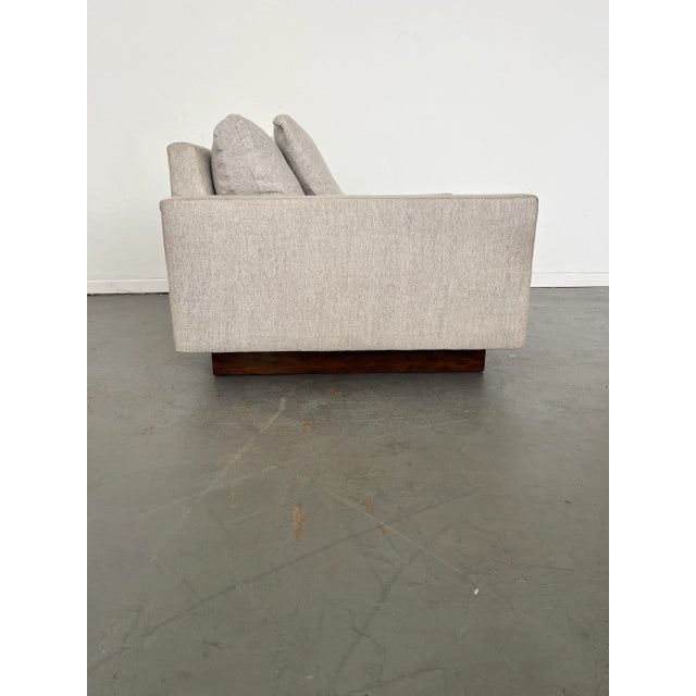 Why you'll love it: - This modern chair is all about comfort. - Pillowy-soft cushions top the spacious body. - Hand-built...