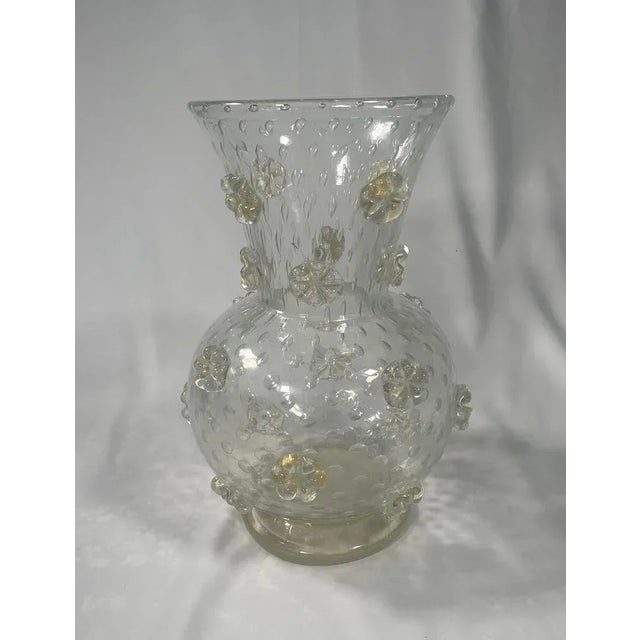 Tall vase from the "a stelle" series in very thick "cristallo" glass with large air bubbles and decorated with stars...