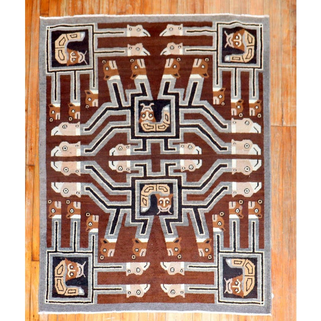 1920s Indonesian brown pictorial square rug depicting numerous faces of people and animals. A conversation piece....