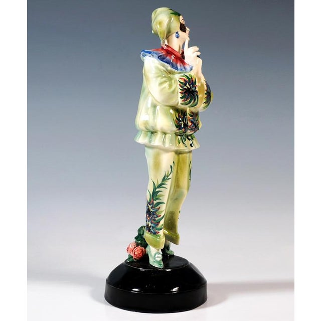 Finest viennese ceramic art from the 1920s: standing young lady, holding a black mask in her folded hands and gazing...