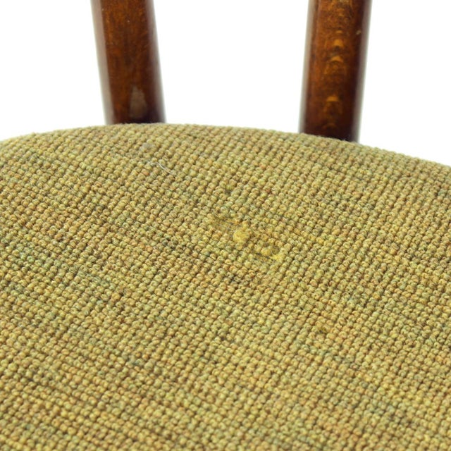 Beautiful set of four dining chairs produced by Tatra company. Original label still visible on the bottom. The chairs are...