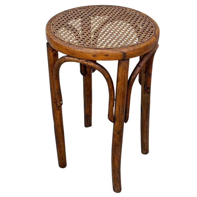 Late Victorian bent oak & cane Thonet low piano stool No. 1 featuring elegant, fluidly splayed legs joined by a circular...