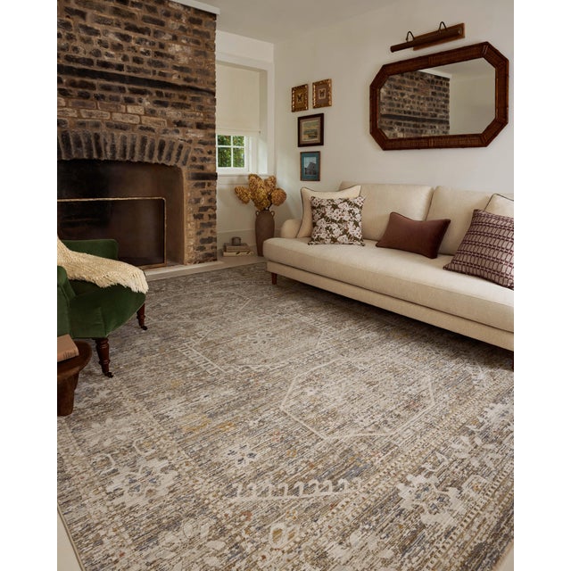 The Ida Collection from Chris Loves Julia x Loloi is a vintage-inspired area rug with a soft, subtly textured pile similar...