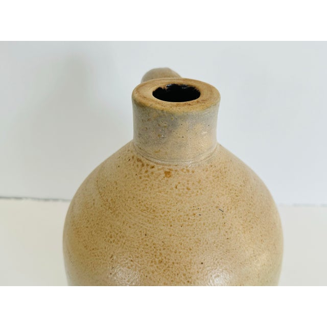 Vintage stoneware handled jug. One gallon size. No marks.