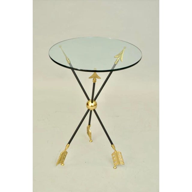 Wonderful neo-classical/mid-century style tripod side table attributed to Maison Jensen. Features an 18 inch round glass...