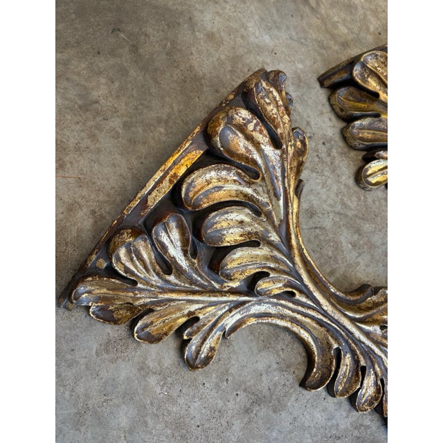 Very impressive pair of twentieth century laurel leaf over sized wall shelves with a light metallic champagne gilt finish....