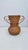 Large amphora vase made of curved wicker, produced by Vivai del Sud. The honey color, typical of the material and finish,...
