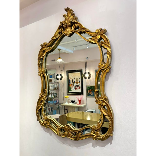 A fantastic large gold giltwood (fiberglass construction) mirror with stunning ornate detailing throughout, in a French...
