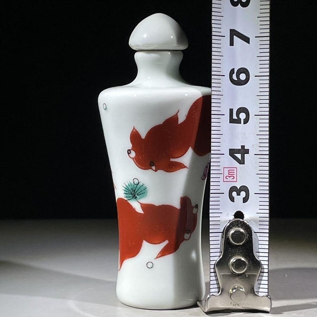 Late 20th Century Iron Red Porcelain Snuff Bottle With Fish Motif For Sale - Image 5 of 9