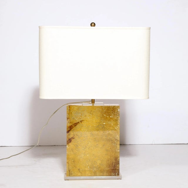 This beautiful modernist pressed lucite table lamp was realized in the United States during the latter half of the 20th...