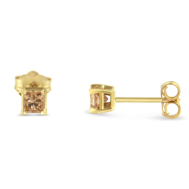 Elevate your elegance with these IGI certified solitaire stud earrings. Graced with the brilliance of 14K yellow gold...