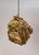 A large, one-of-a-kind pendant light comprised of pieces of driftwood meticulously placed into a bundle. It has two medium...