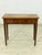 Elegant antique console table made of fine mahogany, crafted around 1920. This piece of furniture impresses with its...