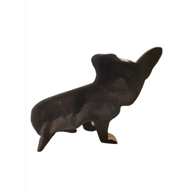 A sweet vintage cast iron black and white cast iron doorstop. Add a little charm to any simple door with this adorable...