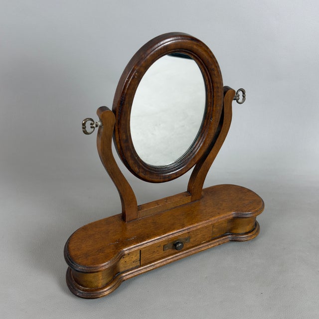 A charming and rare furnishing accessory, perfect for lovers of vintage craftsmanship. This splendid freestanding mirror,...