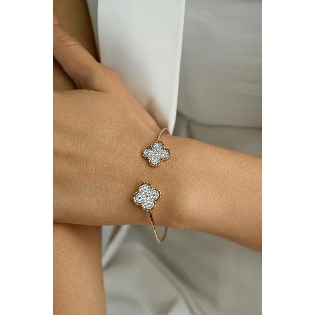 This is part of Chairish’s Fine Jewelry assortment. This Clover Diamond Cuff Bracelet in 18K gold showcases sparkling...