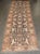 An early 20th-century brown Persian Bakhtiari corridor size rug