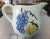 This is a Vintage Stangl Pottery Ceramic Fruit Motif Pitcher. It measures 4 15/16" tall, 6 3/4" wide and 4 1/2" deep. The...