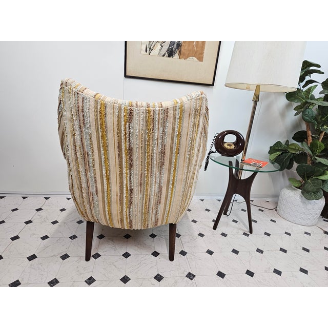 A sculptural silhouette that still turns heads sixty years later. This wingback lounge chair brings serious presence to...