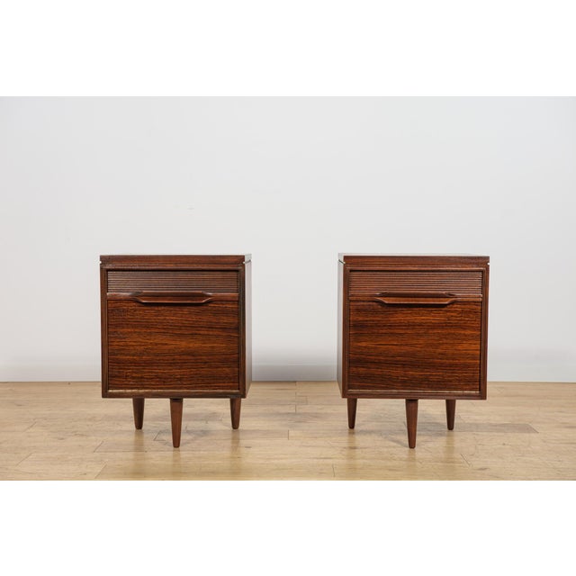 This pair of bedside tables was manufactured by the British furniture maker White & Newton in Portsmouth during the 1960s....