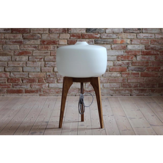 This 1960s floor lamp was made by Czech manufacturer ULUV (Ustredi Lidove a Umelecke Vyroby). It has a large milk-white...