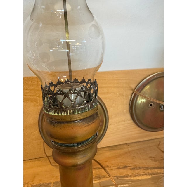 Offering a pair of brass and copper antique wall sconces, believed to have originated in England - wired for US electrical...