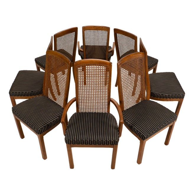 Beautiful set of eight Drexel Heritage dining chairs featuring warm oak frames, woven cane backs, and professionally...