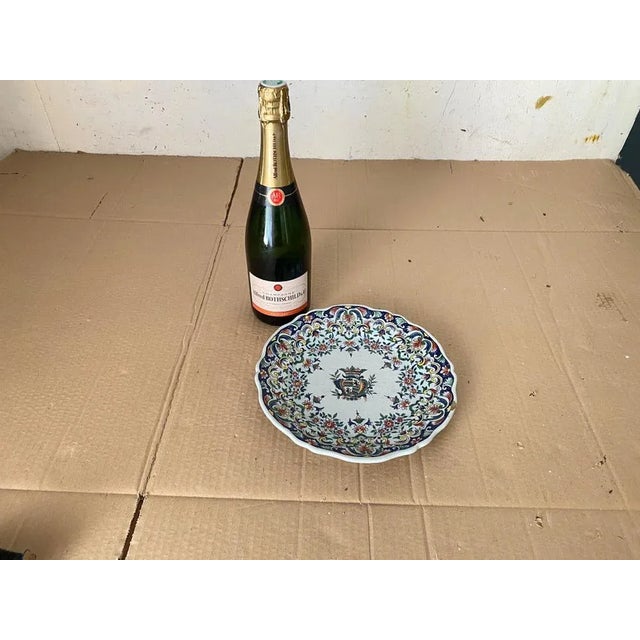 Small plate in Faience. It has been made in France in the 19th century. It is hand painted. with flowers pattern...