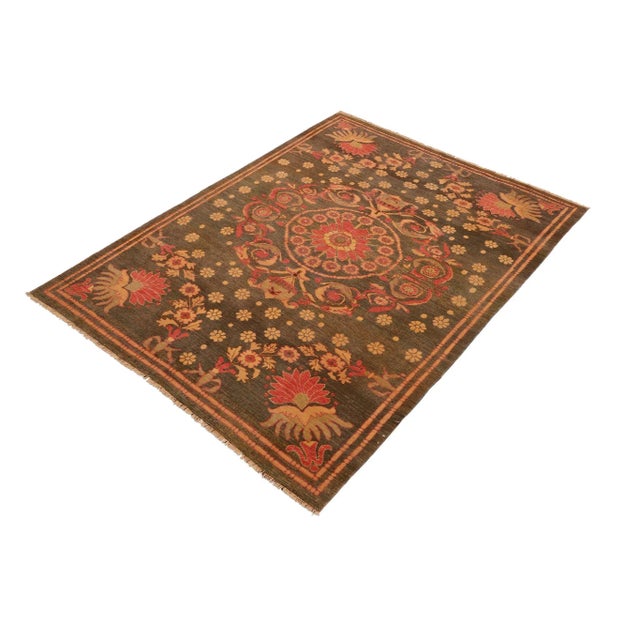 Mesmerizing intricacy and a gorgeous color palette, this hand-knotted masterpiece is a semi-Vintage distressed vintage...