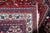A handmade antique Persian Qashqai rug from the 1920s, woven in wool and showcasing the bold tribal artistry of the...