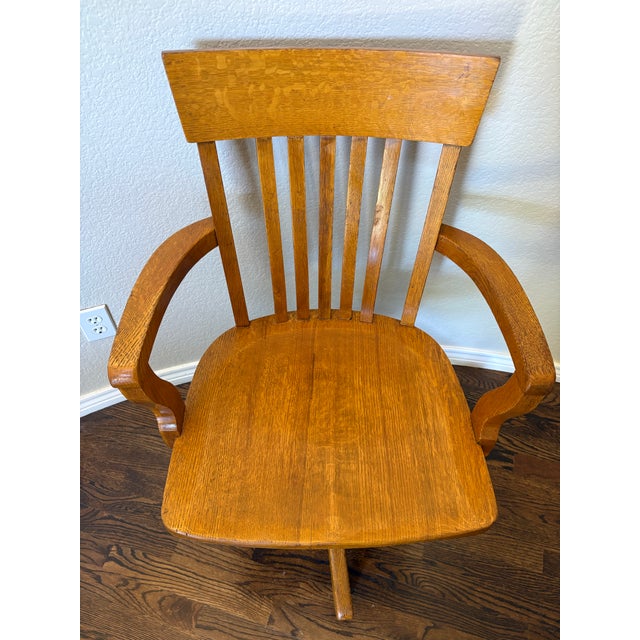 An exceptional early 20th-century J.S. Ford, Johnson & Co. adjustable swivel office chair, expertly manufactured in...