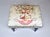 A Faux bamboo bench or ottoman with slightly splayed legs and X stretcher. An opulent, exotic mix of Chinoiserie and...