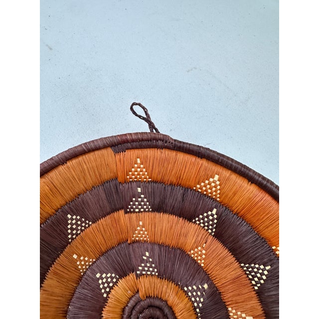 Up for consideration is a beautiful handwoven decorative hanging basket with triangle details. This would look lovely in...