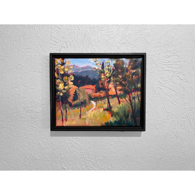 This plein air painting captures the vibrant landscape of Golden Gate Canyon State Park, with a dynamic interplay of light...