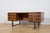This desk was made in the 1970s by the renowned Danish manufacturer Eigil Petersens Møbelfabrik. Crafted from rosewood....
