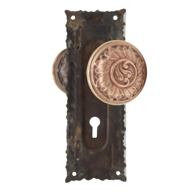 Antique Victorian passage door knob set made by Norwich in 1892. The door knobs are made of a brass front with a cast iron...