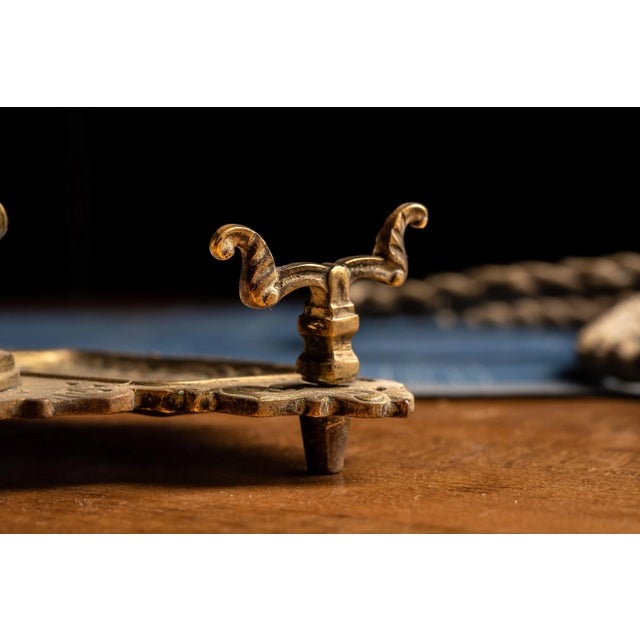 This antique inkwell and tray are made of brass. This inkwell and tray features ornate design. This inkwell and tray...