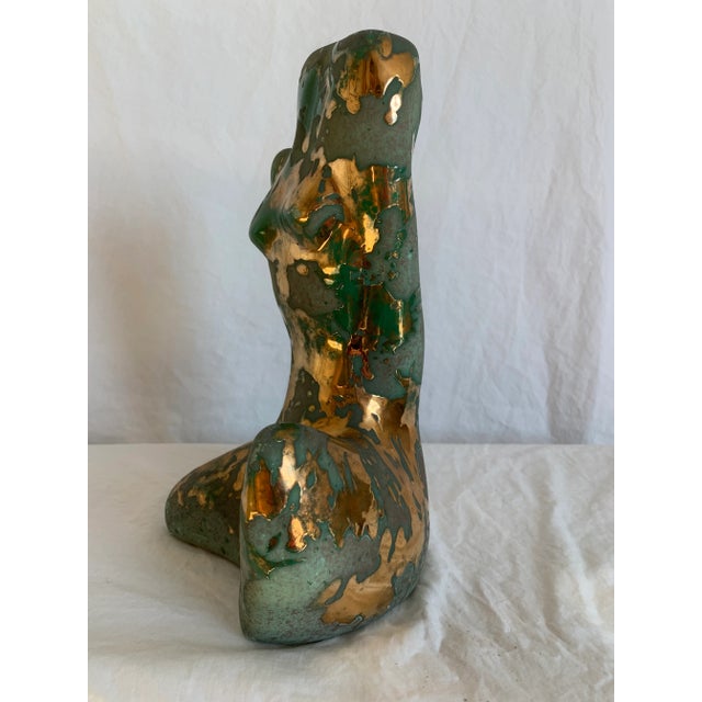 Unique pair of figurative sculptures. Matte green base color with stunning gloss gold swirls. Male is slightly wider than...