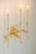 Hammered gold leaf over steel sconce with three electrified candles. 17h x 11.8w x 6d