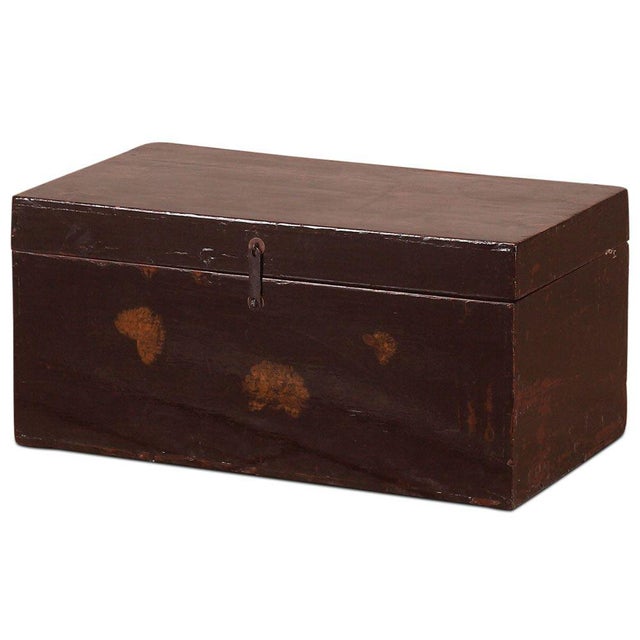 This lovely little blanket trunk has its original black lacquer finish with the old paintings of peony flowers, a symbol...