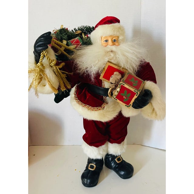 Vintage Santa with presents figurine, 22” high, glass eyes , natural wool beard, rich velvet deep red textile coat. Heavy...