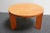 Small, low accent table (table basse) in stained ash with round top supported by three solid rectangular legs designed by...
